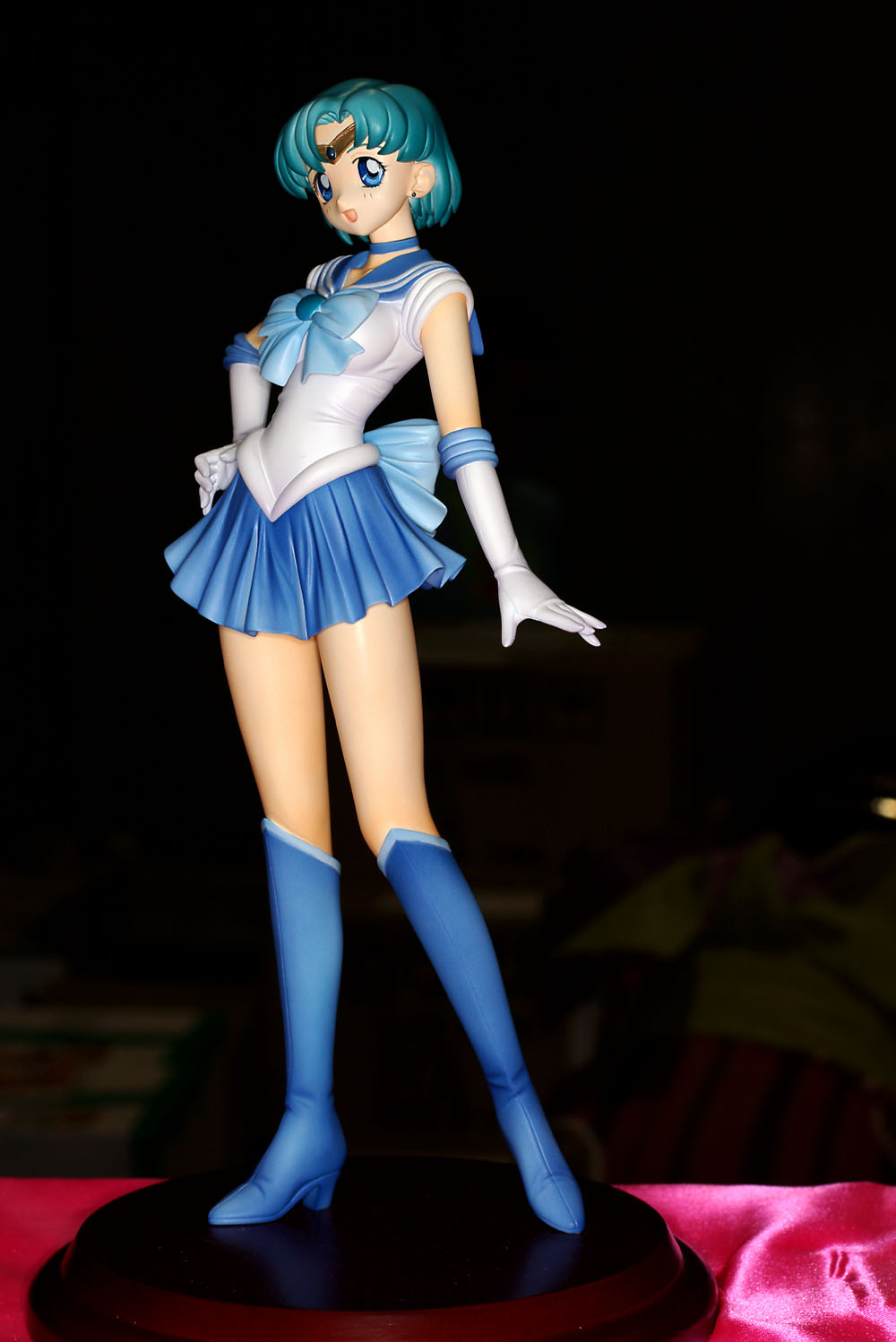 mizuno ami, sailor mercury, bishoujo senshi sailor moon, highres, photo (medium), 1990s (style), 1girl, blue boots, blue eyes, blue hair, blue sailor collar, blue skirt, boots, dark, female focus, figure, knee boots, magical girl, matching hair/eyes, pleated skirt, retro artstyle, sailor collar, school uniform, serafuku, skirt, solo