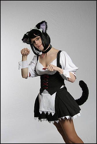 sanada, ufo princess valkyrie, lowres, photo (medium), animal ears, apron, black hair, bob cut, cat ears, cat tail, choker, corset, cosplay, crossdressing, glasses, grin, head tilt, lipstick, makeup, pantyhose, paw pose, short hair, skirt, smile, solo, standing, tail, trap, waist apron, wrist cuffs