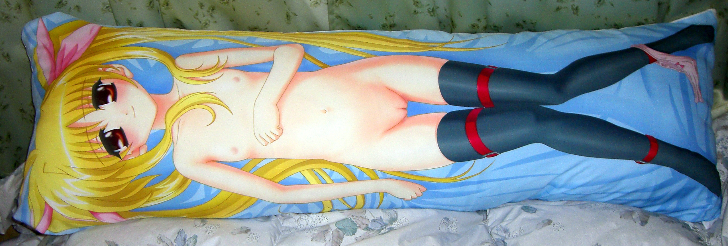 fate testarossa, lyrical nanoha, mahou shoujo lyrical nanoha, highres, long image, photo (medium), wide image, 00s, 1girl, blonde hair, dakimakura (medium), dakimakura (object), female focus, loli, long hair, nude, pillow, pussy, solo, thigh gap, thighhighs