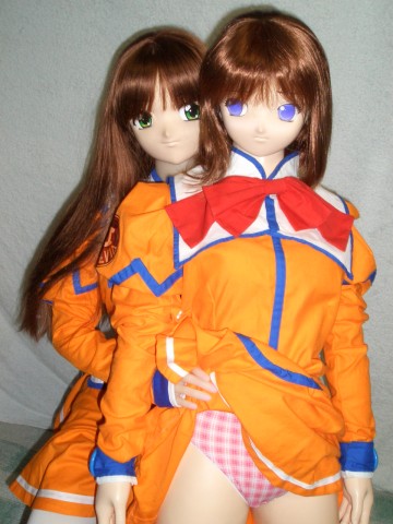 uchuu no stellvia, cosplay photo, lowres, photo (medium), 2girls, clothes lift, cosplay, doll, figure, multiple girls, orange shirt, panties, shirt, skirt, skirt lift, underwear