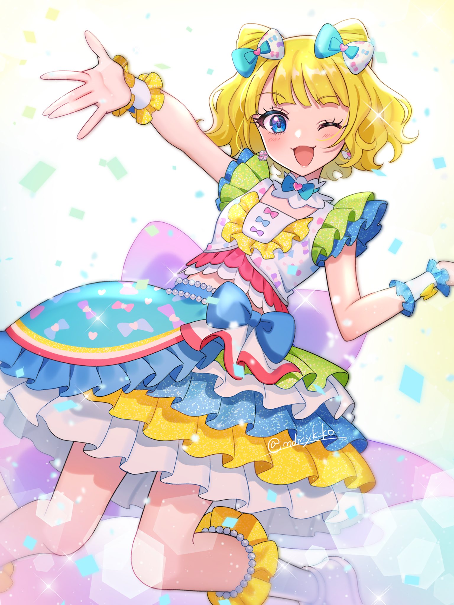 mendamen, minami mirei, pretty series, pripara, commentary request, highres, 1girl, ;3, ;d, blonde hair, blue bow, blue eyes, blunt bangs, boots, bow, cone hair bun, confetti, cropped shirt, double bun, hair bow, hair bun, hand up, idol clothes, layered skirt, looking at viewer, multicolored skirt, one eye closed, open mouth, outstretched arm, shirt, short hair, skirt, smile, solo, sparkle, white boots, white shirt