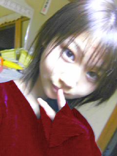 artist request, character request, lowres, photo (medium), 1girl, brown eyes, brown hair, cosplay, female focus, finger to mouth, indoors, looking at viewer, nevada-tan (cosplay), portrait, qvga, short hair, smile, solo, v