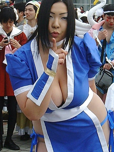 setsunakaizuki, kasumi (doa), dead or alive, tecmo, cosplay photo, photo (medium), 1girl, asian, breasts, cigarette, cleavage, cosplay, female focus, huge breasts, index finger raised, japanese clothes, kasumi (doa) (cosplay), large breasts, leaning forward, makeup, multiple boys, outdoors, panties, plump, school uniform, serafuku, side-tie panties, solo, underwear
