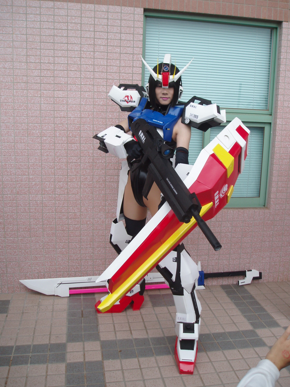 strike gundam, gundam, gundam seed, cosplay photo, highres, photo (medium), beam rifle, cosplay, energy gun, gun, mobilesuit, shield, solo, sword, weapon