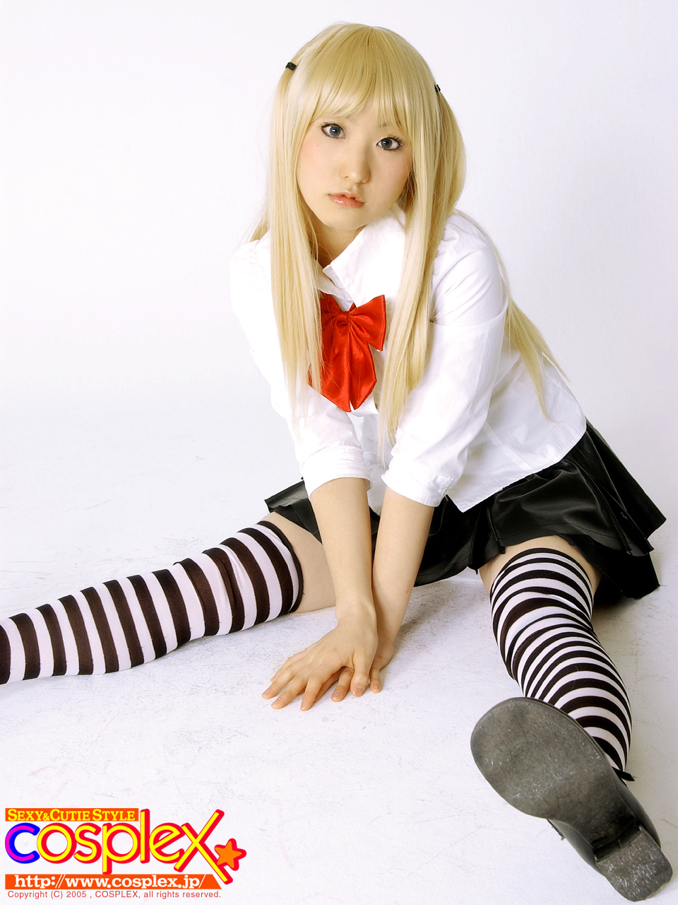 amane misa, cosplex, death note, cosplay photo, highres, photo (medium), blonde hair, blouse, blue eyes, bow, cosplay, head tilt, shirt, sitting, skirt, solo, striped clothes, striped thighhighs, thighhighs, thighs, twintails, zettai ryouiki