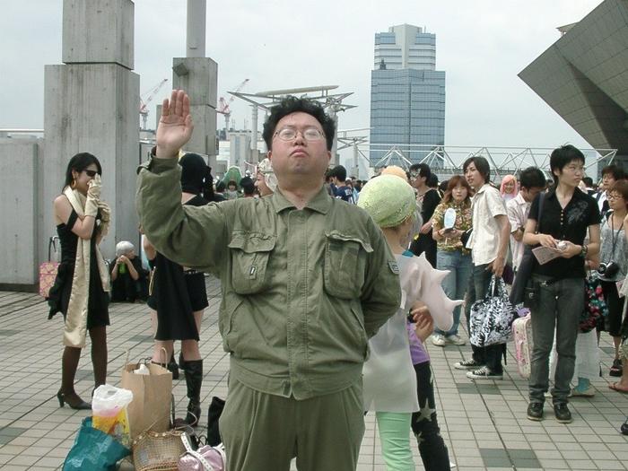 kim jong-il, tokyo big sight, cosplay photo, off-topic, photo (medium), 6+boys, 6+girls, arm behind back, collared jacket, cosplay, jacket, multiple boys, multiple girls