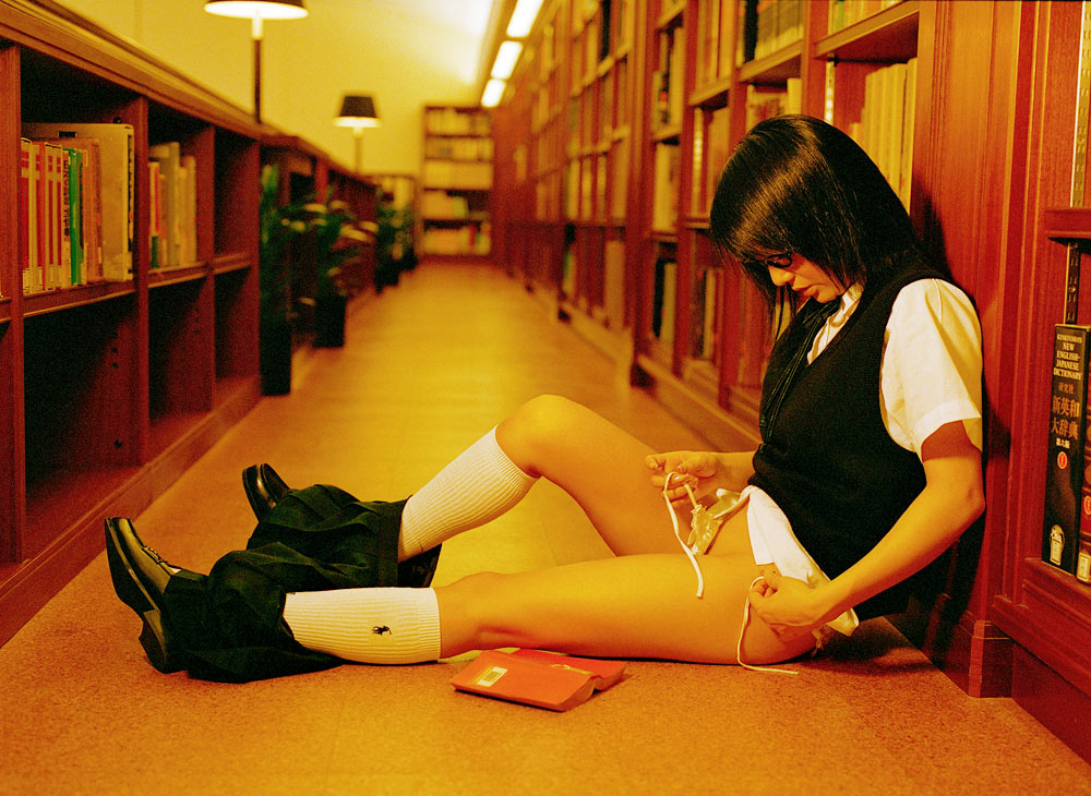 photo (medium), 1girl, asian, female focus, glasses, kneehighs, library, panties, school uniform, serafuku, side-tie panties, socks, solo, sweater, sweater vest, underwear, vest
