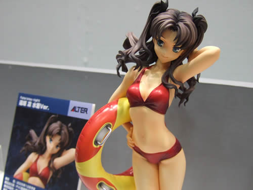 tohsaka rin, fate/hollow ataraxia, fate/stay night, fate (series), wonder festival, wonder festival 2005, lowres, photo (medium), 00s, 1girl, bikini, female focus, figure, innertube, solo, swim ring, swimsuit, twintails, two side up