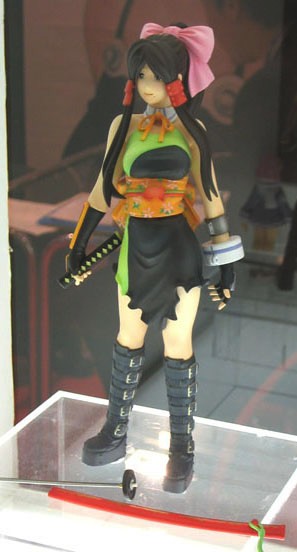 oono kanako, genshiken, kujibiki unbalance, cosplay photo, photo (medium), tagme, 1girl, boots, breasts, cosplay, female focus, figure, fingerless gloves, gloves, hair ribbon, holding, holding sword, holding weapon, long hair, medium breasts, obi, ribbon, sash, solo, standing, sword, weapon