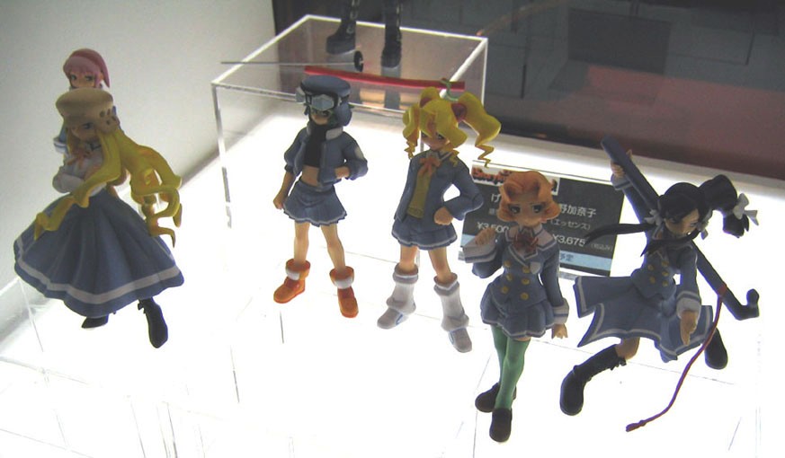 akiyama tokino, asagiri komaki, kisaragi kasumi, ritsuko kubel kettenkrad, tachibana izumi, kujibiki unbalance, green legwear, photo (medium), 00s, 6+girls, blonde hair, double-breasted, figure, long hair, multiple girls, orange hair, pink hair, pleated skirt, skirt, standing, thighhighs