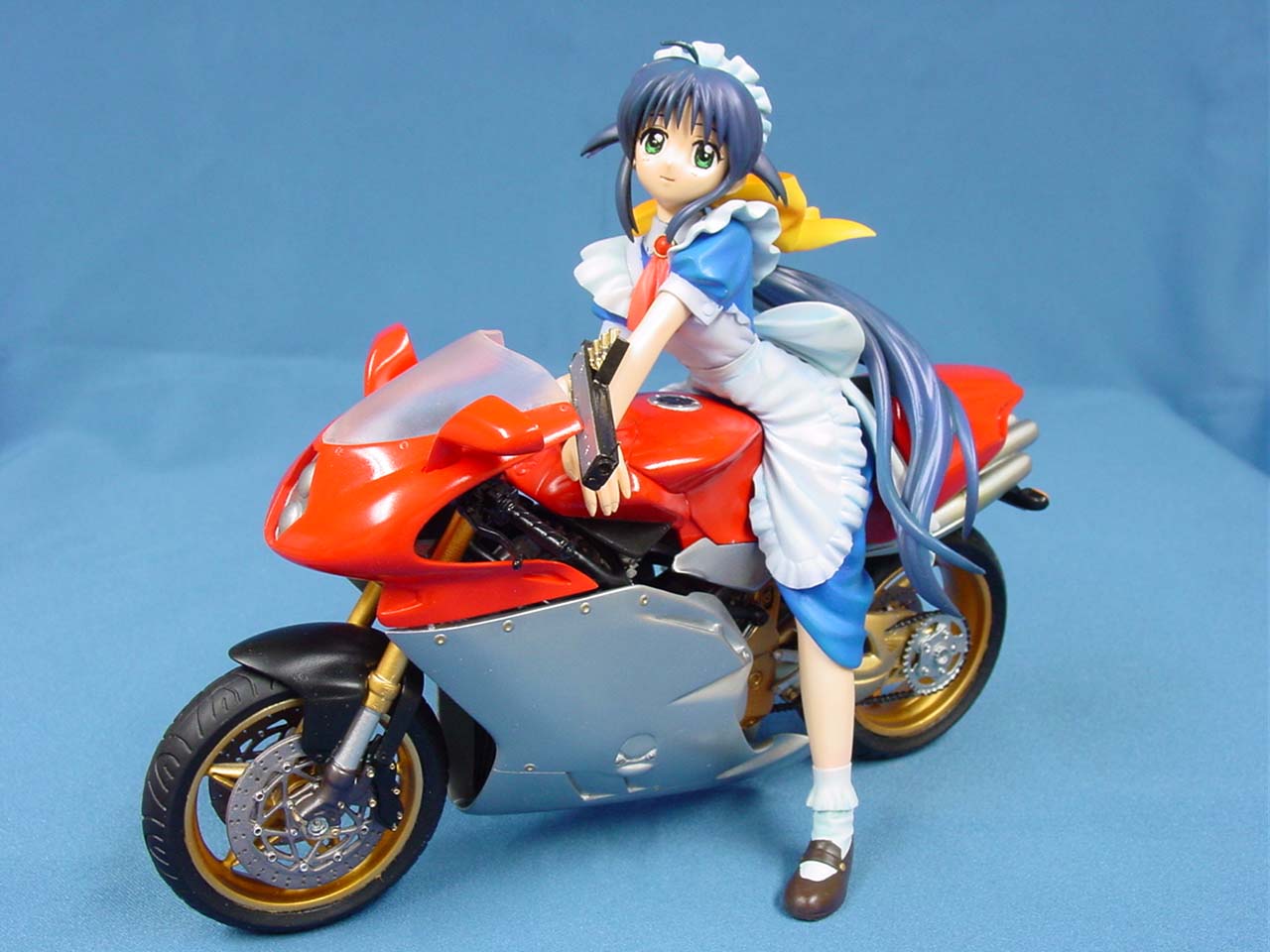 andou mahoro, mahoromatic, vehicle, photo (medium), 1girl, blue hair, female focus, figure, full body, green eyes, gun, maid, motor vehicle, motorcycle, solo, weapon