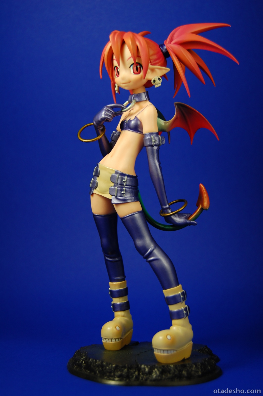 etna (disgaea), disgaea, makai senki disgaea, highres, photo (medium), 00s, bat wings, boots, bracelet, buckle, collar, earrings, elbow gloves, figure, flat chest, gloves, jewelry, pointy ears, red eyes, red hair, skirt, solo, tail, thighhighs, twintails, wings, zettai ryouiki
