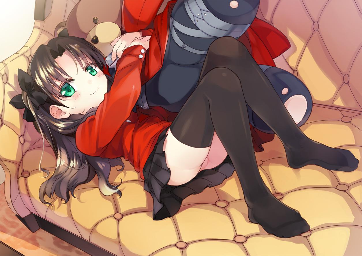 rori chuushin, tohsaka rin, fate/stay night, fate (series), commentary request, 1girl, aged down, black hair, black thighhighs, blush, couch, flat chest, full body, green eyes, long hair, looking at viewer, lying, on back, skirt, smile, solo, stuffed animal, stuffed toy, teddy bear, thighhighs
