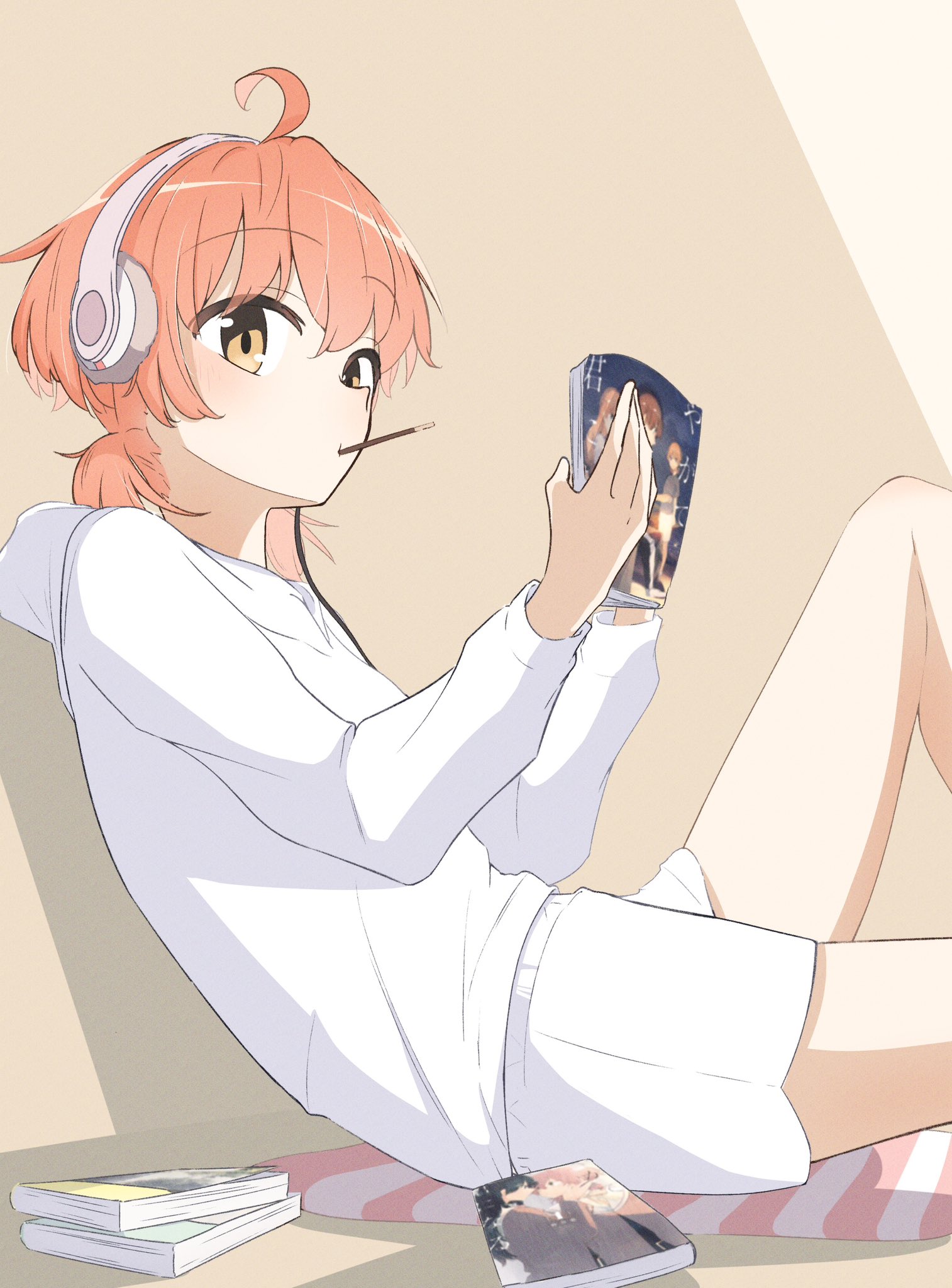 koito yuu, nanami touko, saeki sayaka, yagate kimi ni naru, commentary request, highres, 1girl, ahoge, brown eyes, food, food in mouth, headphones, hood, hood down, hoodie, long sleeves, low twintails, manga (object), nobunaga (nbng g), orange hair, pocky, pocky in mouth, short hair, short twintails, shorts, solo, twintails, white hoodie, white shorts, yuri (object)
