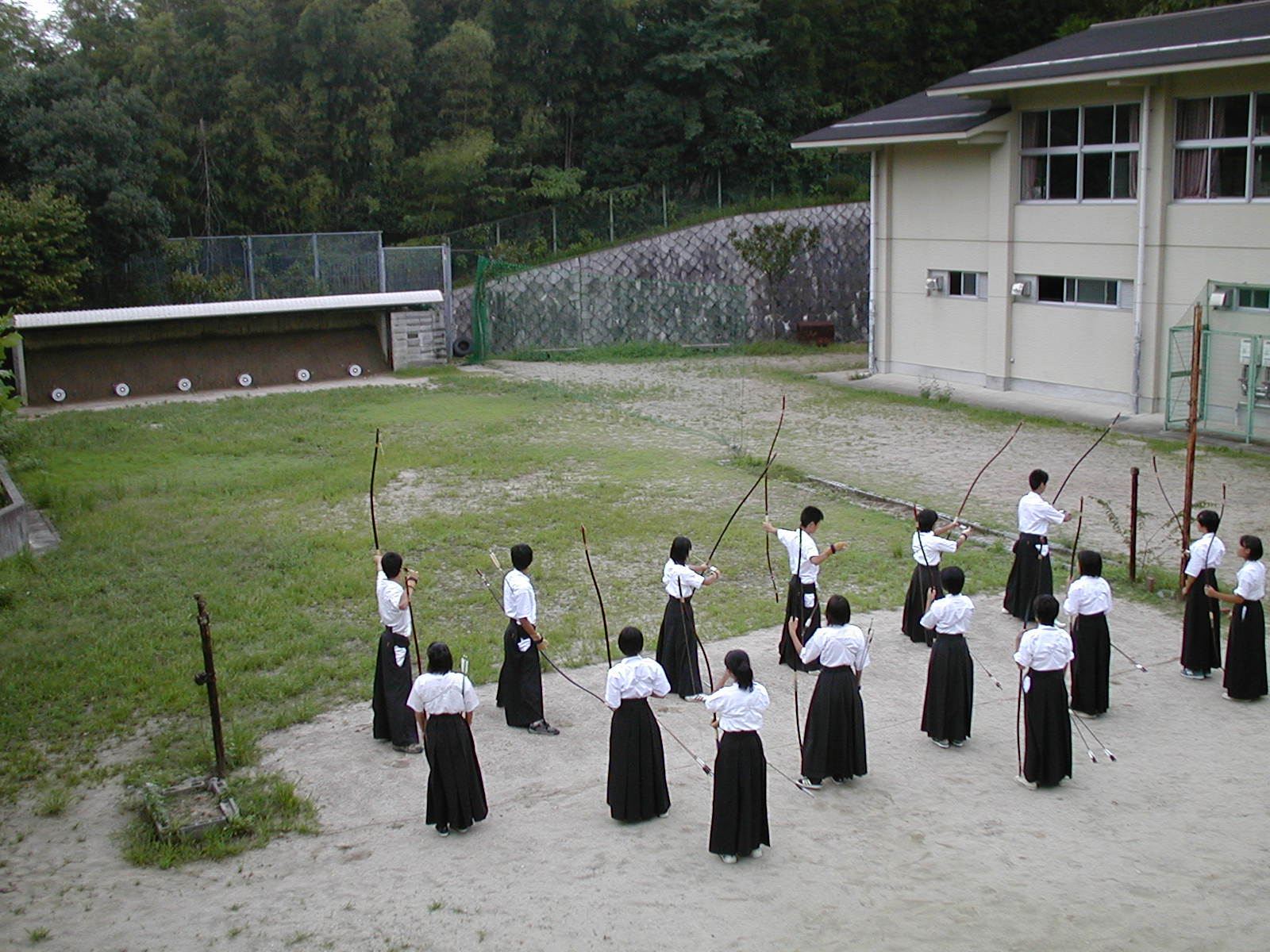 range, highres, photo (medium), archery, arrow (projectile), asian, bow, bow (weapon), marksman, multiple boys, multiple girls, target, weapon