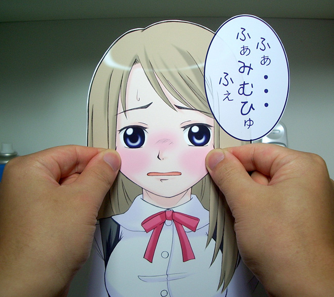sasaki yukinojou, papercraft (medium), photo (medium), translation request, unconventional media, 1girl, blue eyes, blush, cheek pinching, interactive media, long hair, paper child, pinching, solo focus