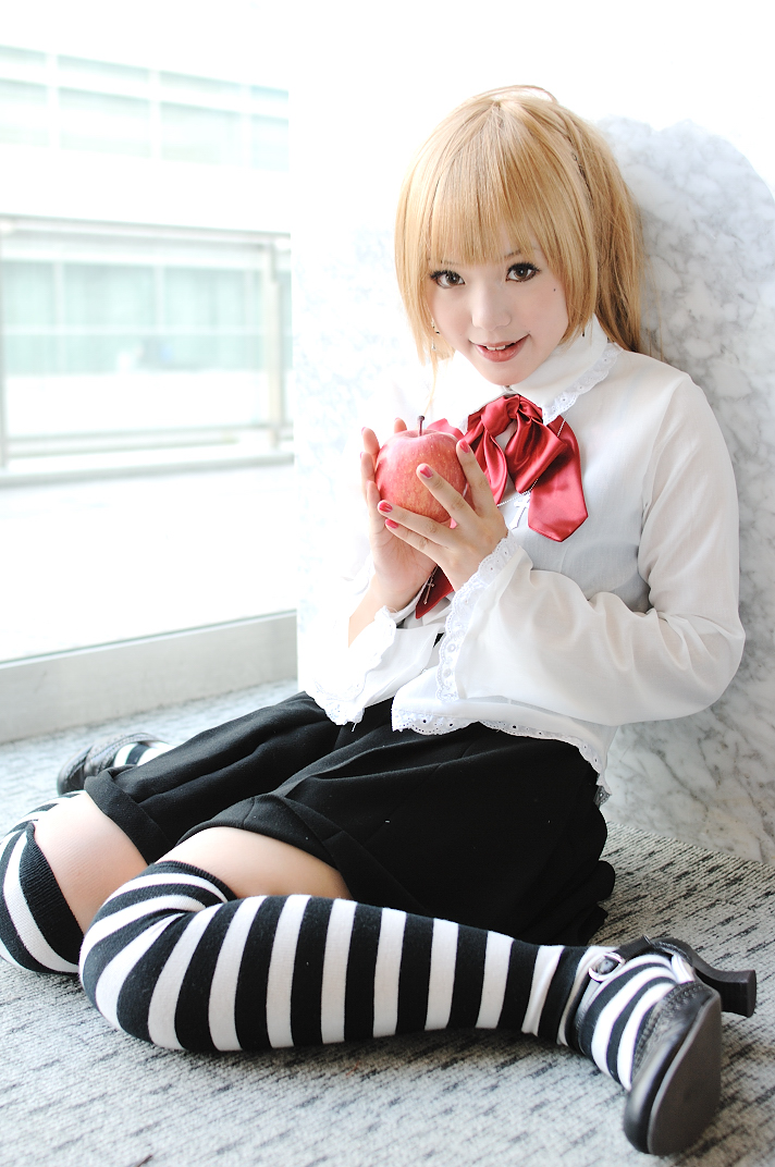 kipi-san, amane misa, death note, striped, photo (medium), 1girl, amane misa (cosplay), apple, asian, blonde hair, breasts, cosplay, female focus, food, fruit, high heels, long hair, looking at viewer, mole, shoes, sitting, small breasts, solo, thighhighs, wariza