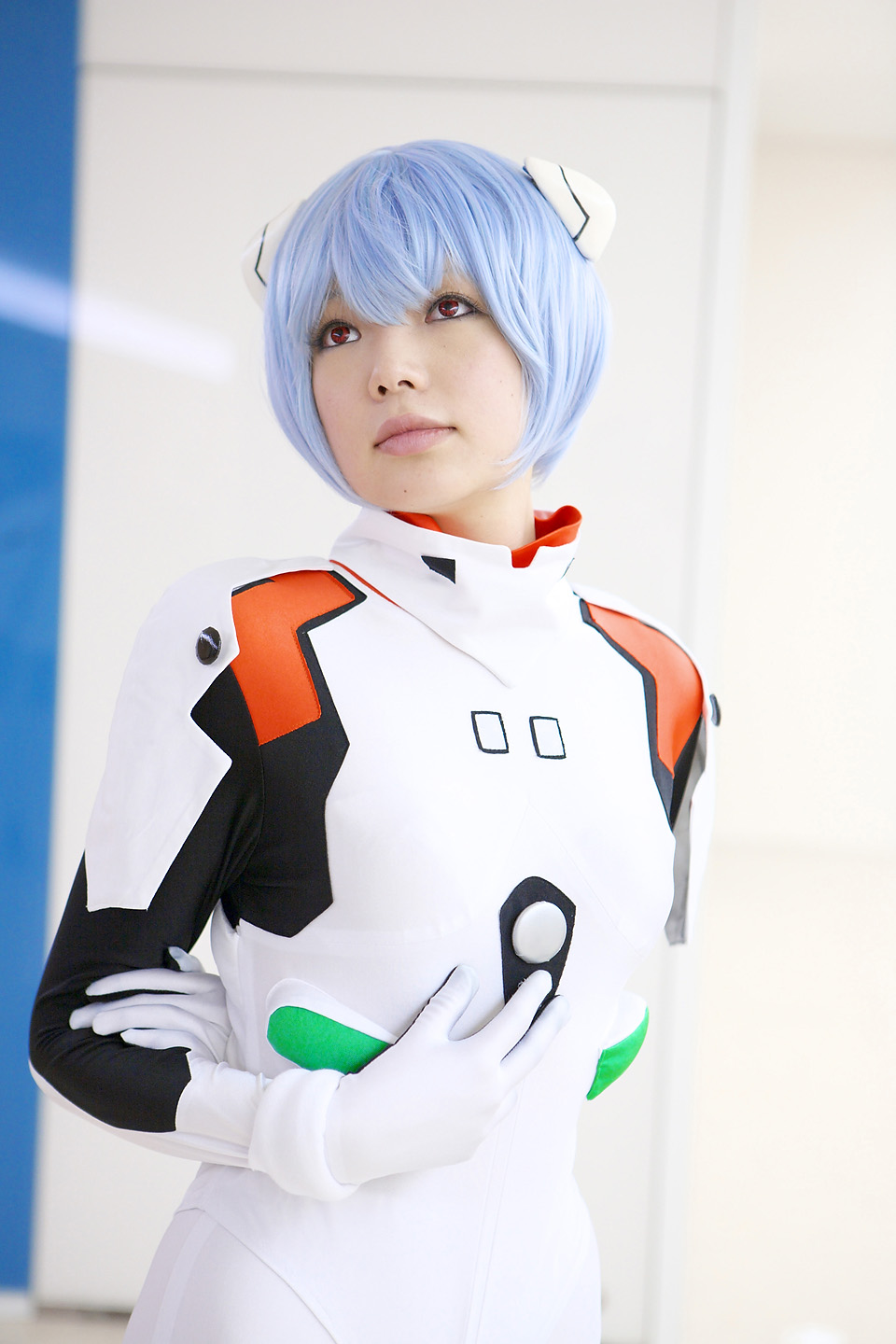 namada, ayanami rei, neon genesis evangelion, highres, photo (medium), 1girl, asian, blue hair, breasts, color contacts, cosplay, female focus, hairpods, looking up, mecha pilot suit, plugsuit (cosplay), plugsuit (evangelion), red eyes, short hair, small breasts, solo, standing