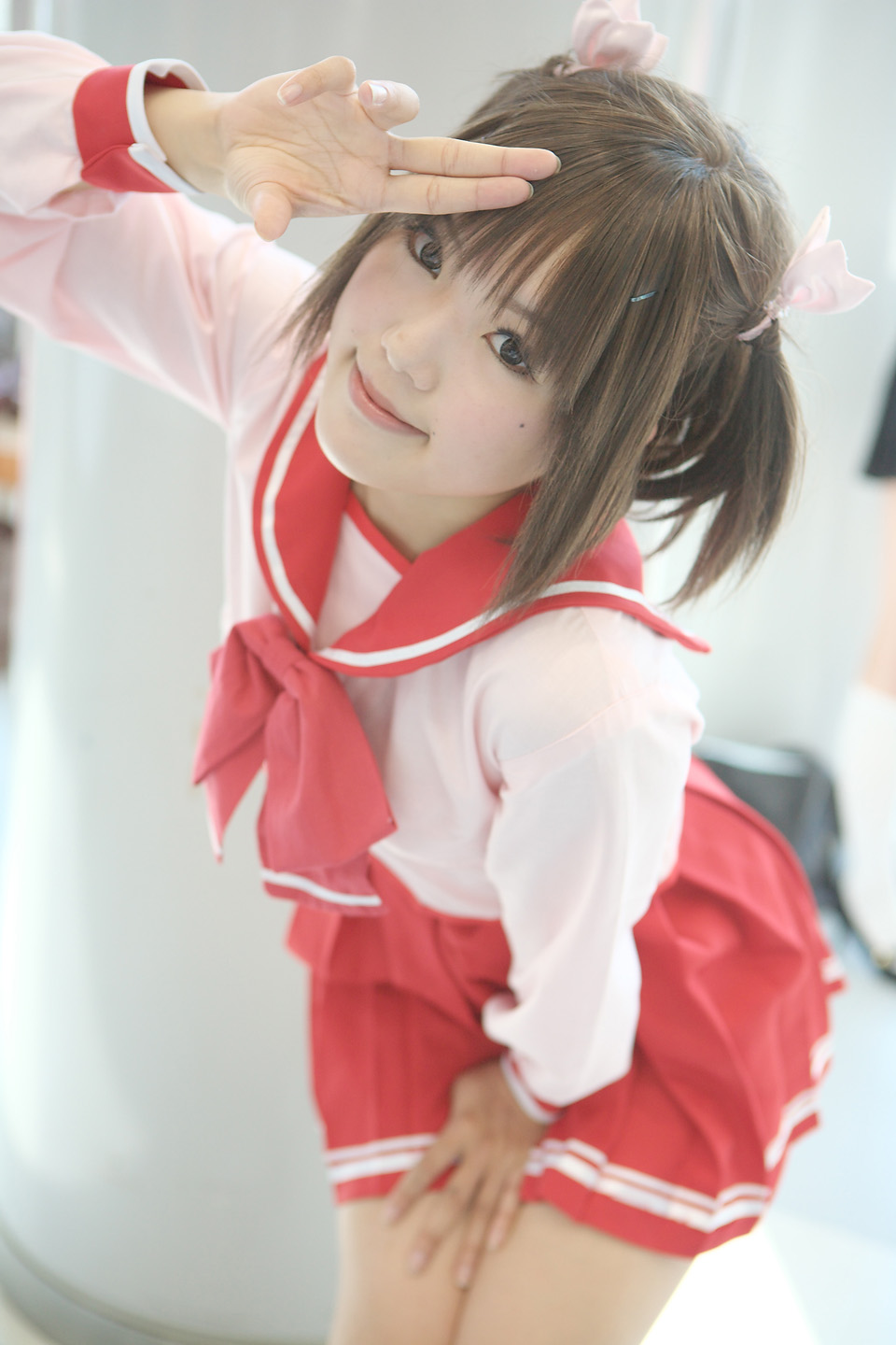 kipi-san, yuzuhara konomi, to heart (series), to heart 2, highres, photo (medium), 1girl, asian, brown hair, cosplay, female focus, looking at viewer, mole, outdoors, school uniform, serafuku, short hair, solo, twintails, yuzuhara konomi (cosplay)
