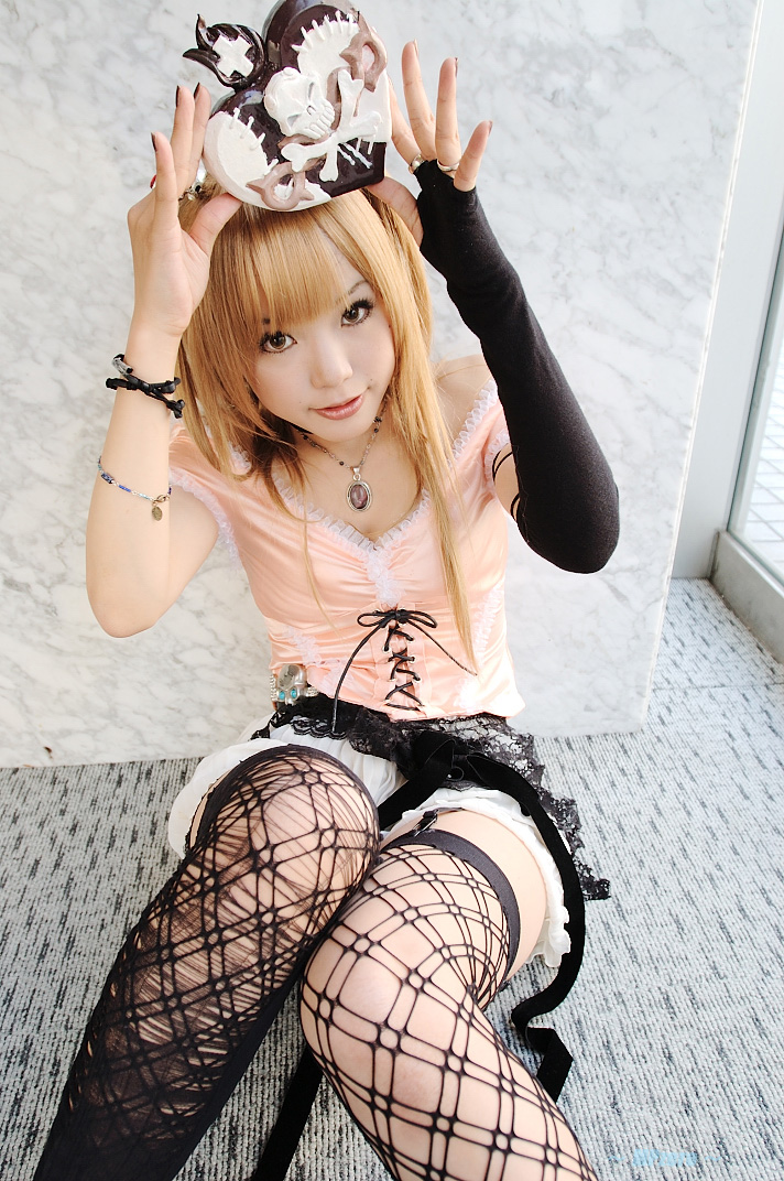 kipi-san, amane misa, death note, photo (medium), 1girl, amane misa (cosplay), asian, bare shoulders, blonde hair, breasts, cosplay, cross, female focus, fingerless gloves, garter straps, gloves, hair ornament, indoors, jewelry, long hair, looking at viewer, miniskirt, mole, pendant, ring, single glove, skirt, skull and crossbones, skull hair ornament, small breasts, solo, thighhighs, two side up, zettai ryouiki