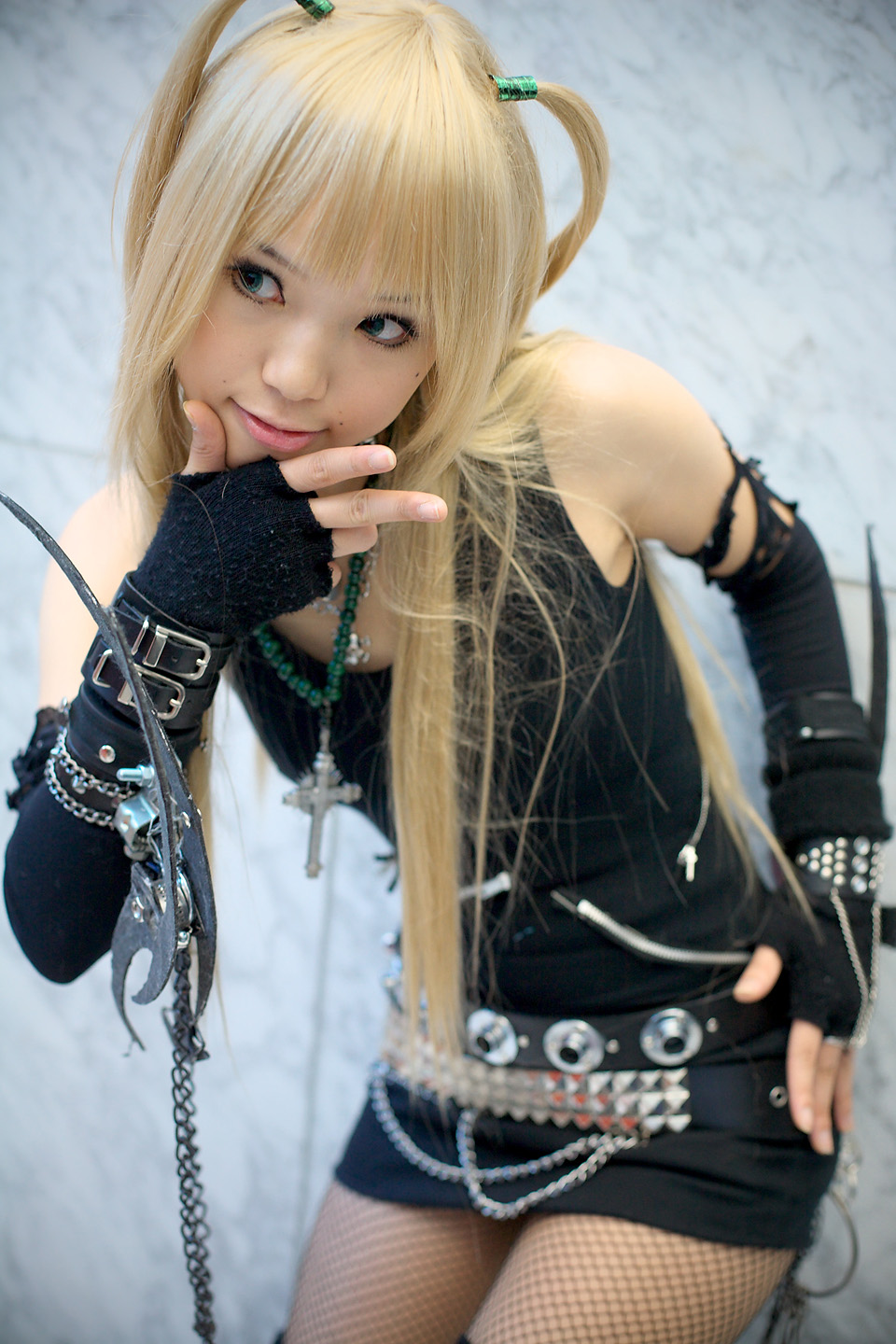 kipi-san, amane misa, death note, highres, photo (medium), 1girl, amane misa (cosplay), asian, blonde hair, breasts, color contacts, cosplay, cross, cross necklace, female focus, fingerless gloves, fishnet pantyhose, fishnets, gloves, indoors, jewelry, long hair, miniskirt, mole, necklace, pantyhose, skirt, small breasts, solo, two side up