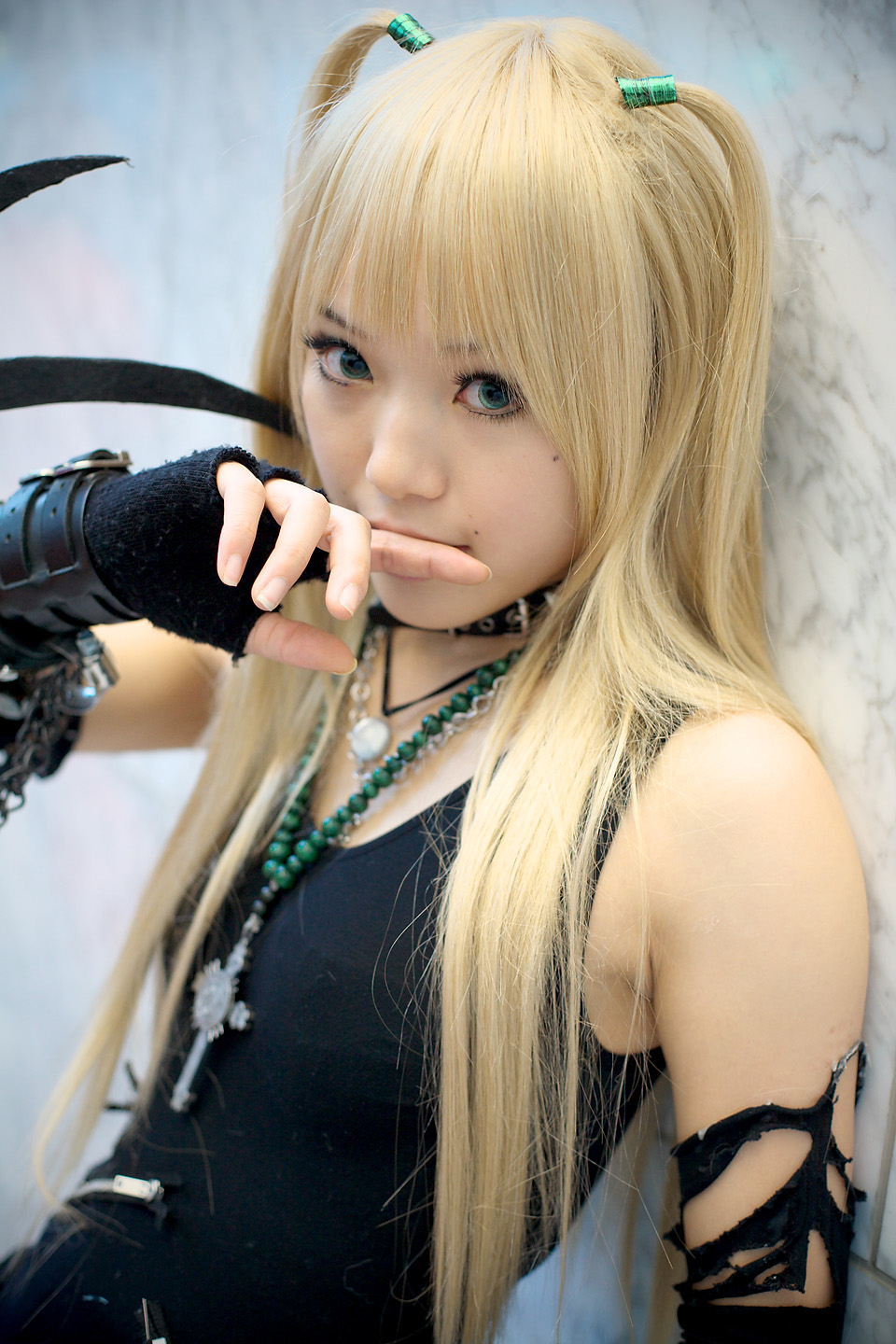 kipi-san, amane misa, death note, highres, photo (medium), 1girl, amane misa (cosplay), asian, blonde hair, blue eyes, breasts, color contacts, cosplay, cross, cross necklace, female focus, fingerless gloves, gloves, indoors, jewelry, long hair, mole, necklace, small breasts, solo, two side up