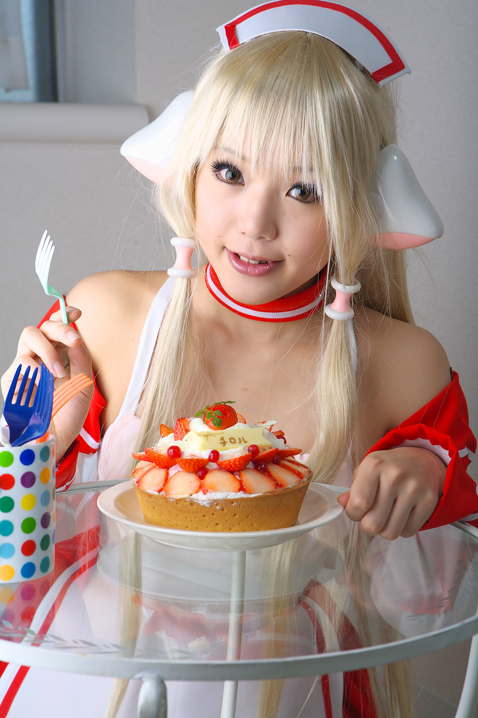 kipi-san, chii, chobits, highres, photo (medium), 1girl, apron, asian, blonde hair, cake, chii (cosplay), cosplay, female focus, food, indoors, long hair, looking at viewer, persocom, solo, strawberry shortcake, waitress, waitress uniform