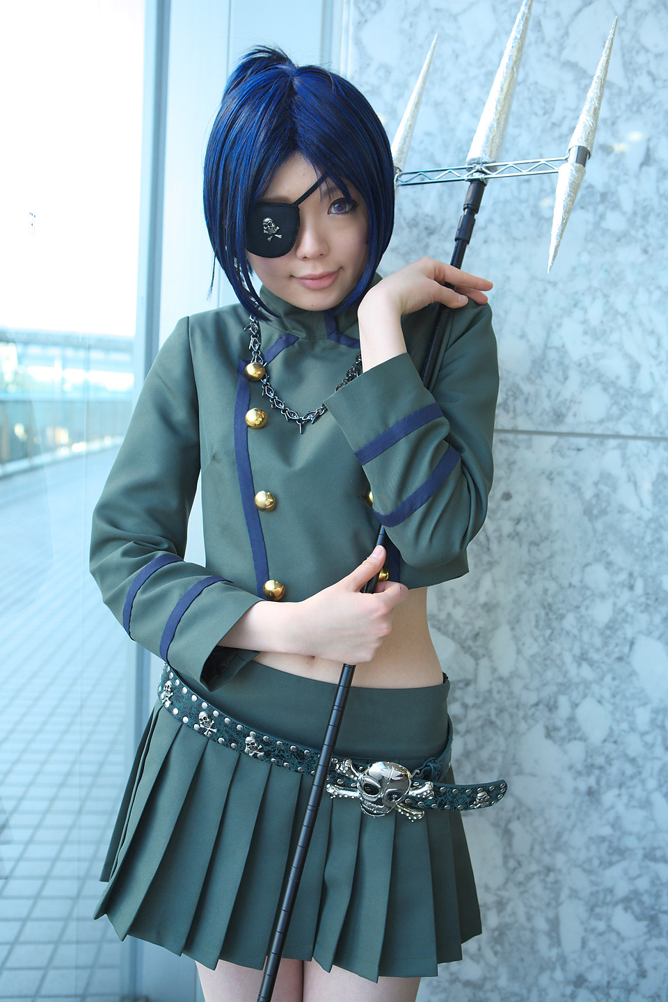 namada, chrome dokuro, katekyo hitman reborn!, highres, photo (medium), 1girl, asian, blue hair, breasts, color contacts, cosplay, cowboy shot, eyepatch, female focus, indoors, looking at viewer, midriff, miniskirt, pleated skirt, polearm, short hair, skirt, skull and crossbones, skull belt, small breasts, solo, spear, standing, trident, weapon, window