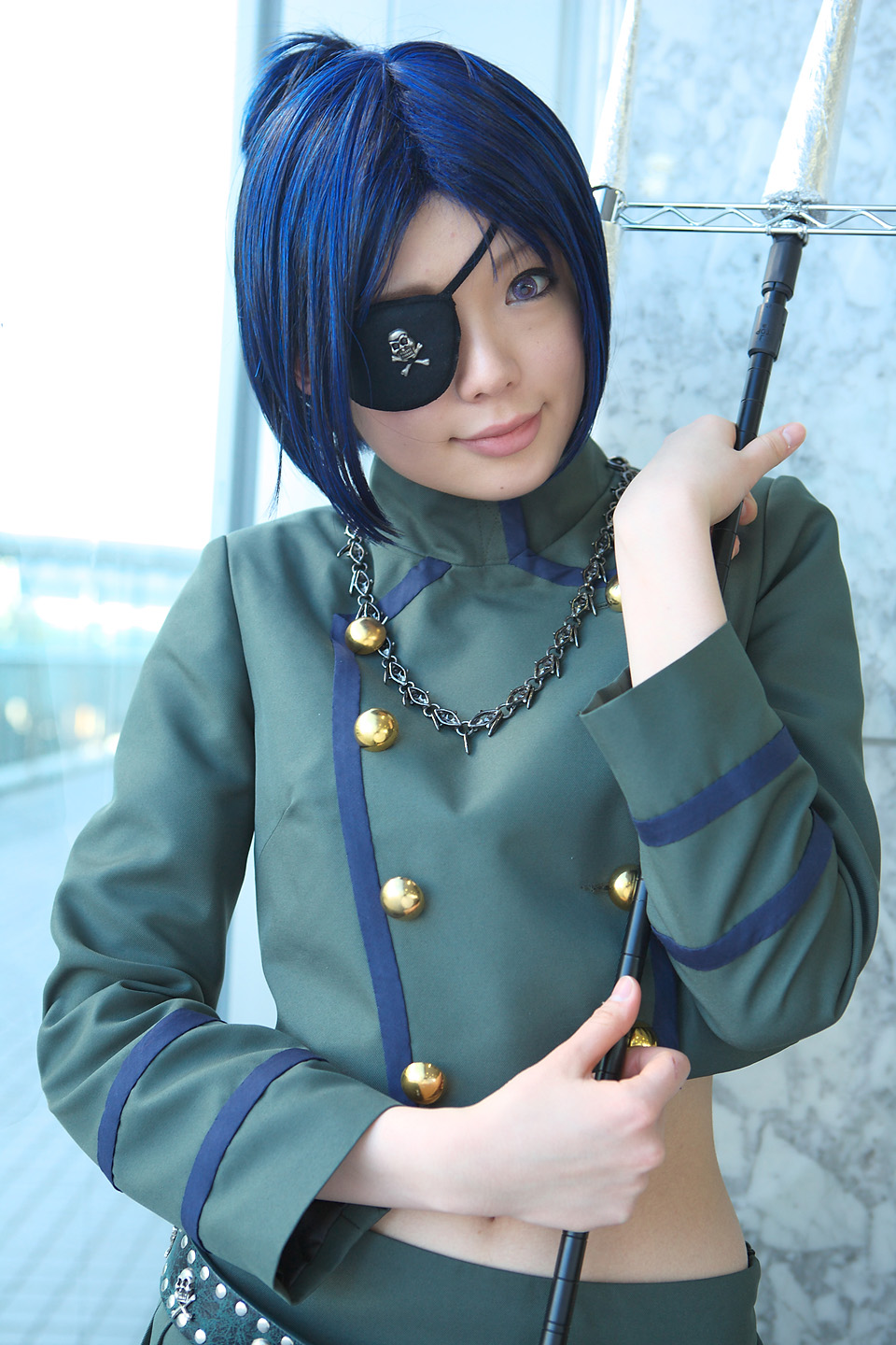 namada, chrome dokuro, katekyo hitman reborn!, highres, photo (medium), 1girl, asian, blue hair, breasts, color contacts, cosplay, eyepatch, female focus, indoors, light smile, looking at viewer, makeup, mascara, midriff, miniskirt, pleated skirt, polearm, short hair, skirt, skull and crossbones, skull belt, small breasts, solo, spear, standing, trident, weapon, window