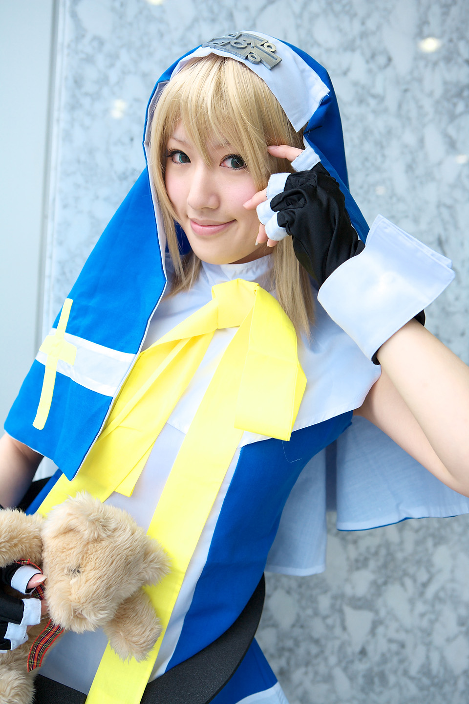saya (cosplayer), bridget (guilty gear), arc system works, guilty gear, highres, photo (medium), cosplay, cross, smile, solo, teddy bear
