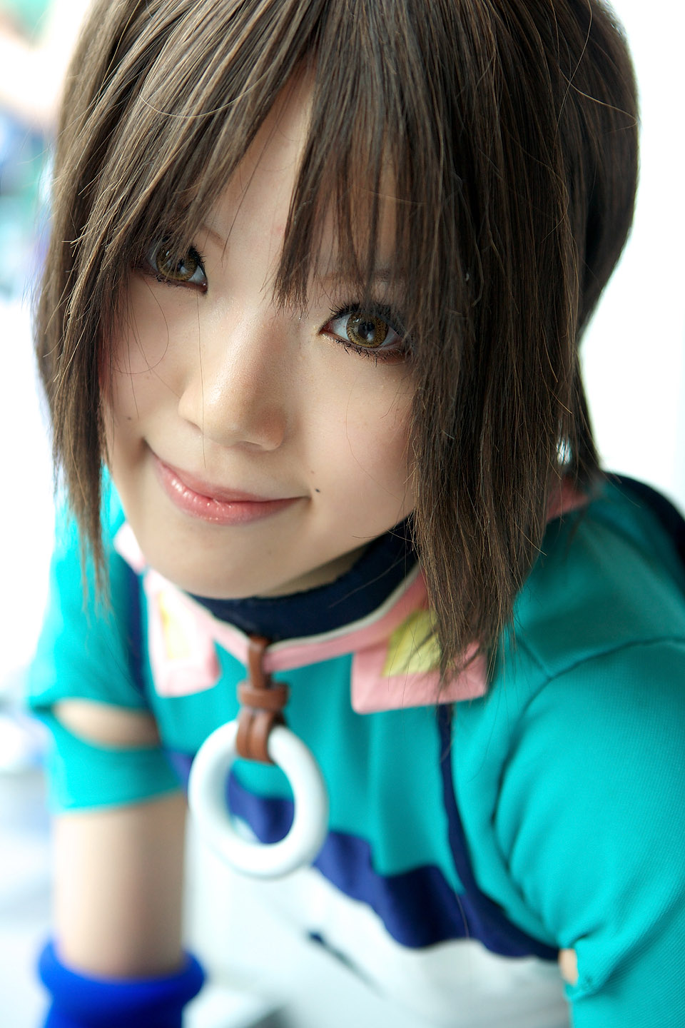 kipi-san, mel, gensou suikoden, highres, photo (medium), 1girl, asian, blurry, brown eyes, brown hair, cosplay, depth of field, elbow gloves, female focus, gloves, looking at viewer, mel (cosplay), mole, short hair, smile, solo