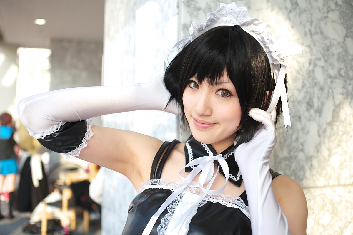 saya (cosplayer), sawatari izumi, kore ga watashi no goshujin-sama, photo (medium), 1girl, apron, armpits, asian, bare shoulders, black hair, blurry, cosplay, depth of field, detached collar, elbow gloves, facing viewer, garter straps, gloves, japanese (nationality), looking at viewer, maid, maid apron, maid headdress, nakabayashi yoshitaka's maid uniform, sawatari izumi (cosplay), short hair, solo focus, standing, upper body