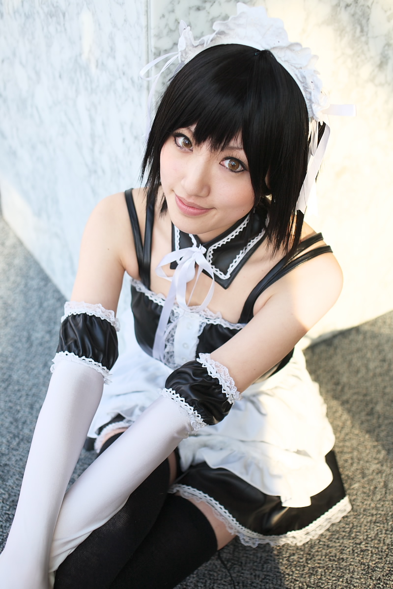 saya (cosplayer), sawatari izumi, kore ga watashi no goshujin-sama, highres, photo (medium), 1girl, apron, asian, bare shoulders, black hair, blurry, cosplay, cowboy shot, depth of field, detached collar, elbow gloves, facing viewer, female focus, finger to mouth, gloves, japanese (nationality), looking at viewer, maid, maid apron, maid headdress, nakabayashi yoshitaka's maid uniform, on floor, sawatari izumi (cosplay), short hair, sitting, solo, thighhighs, upper body, waist apron, white apron, white gloves