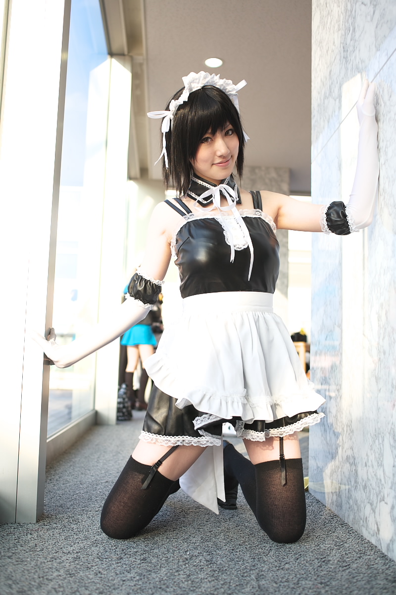 saya (cosplayer), sawatari izumi, kore ga watashi no goshujin-sama, black footwear, highres, photo (medium), 1girl, apron, asian, bare shoulders, black hair, black thighhighs, blurry, cosplay, depth of field, detached collar, elbow gloves, facing viewer, full body, garter straps, gloves, japanese (nationality), kneeling, looking at viewer, maid, maid apron, maid headdress, multiple girls, nakabayashi yoshitaka's maid uniform, sawatari izumi (cosplay), short hair, sitting, solo focus, thighhighs, waist apron, white apron, white gloves, zettai ryouiki