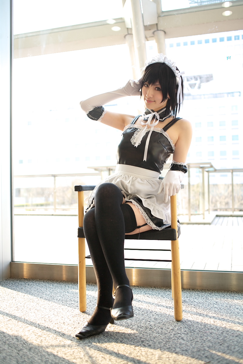 saya (cosplayer), sawatari izumi, kore ga watashi no goshujin-sama, black footwear, highres, photo (medium), 1girl, apron, asian, bare shoulders, black hair, black thighhighs, blurry, chair, cosplay, crossed legs, day, depth of field, detached collar, elbow gloves, facing viewer, female focus, full body, garter straps, gloves, japanese (nationality), looking at viewer, maid, maid apron, maid headdress, nakabayashi yoshitaka's maid uniform, sawatari izumi (cosplay), short hair, sitting, solo, thighhighs, waist apron, white apron, white gloves, window, zettai ryouiki