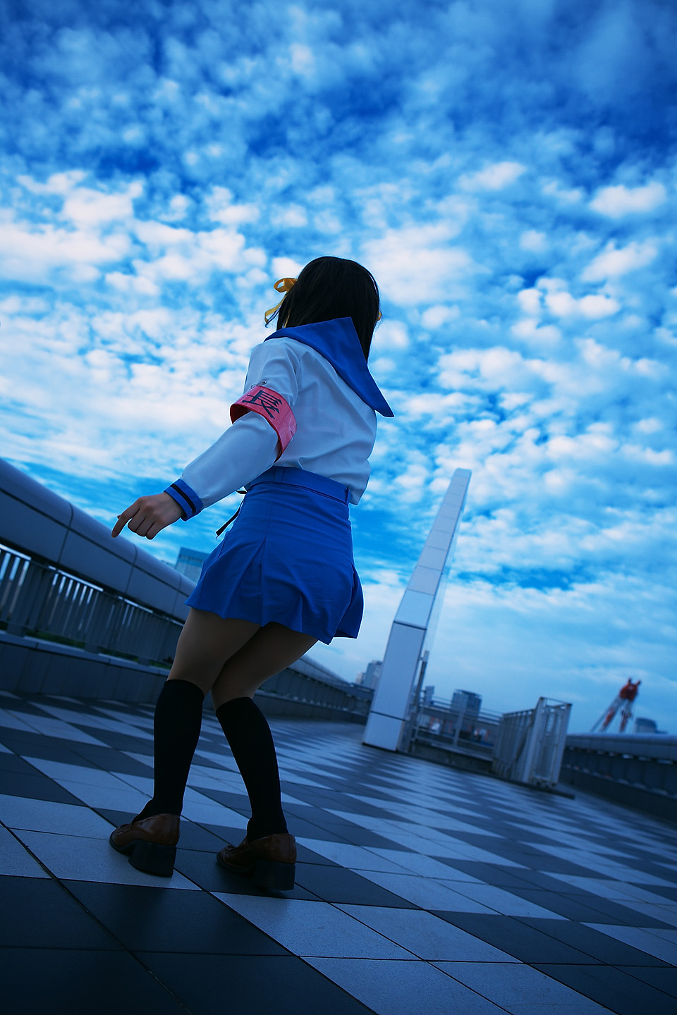 kipi-san, suzumiya haruhi, suzumiya haruhi no yuuutsu, highres, photo (medium), 1girl, armband, asian, cloud, cosplay, dutch angle, female focus, outdoors, school uniform, sky, solo, suzumiya haruhi (cosplay)