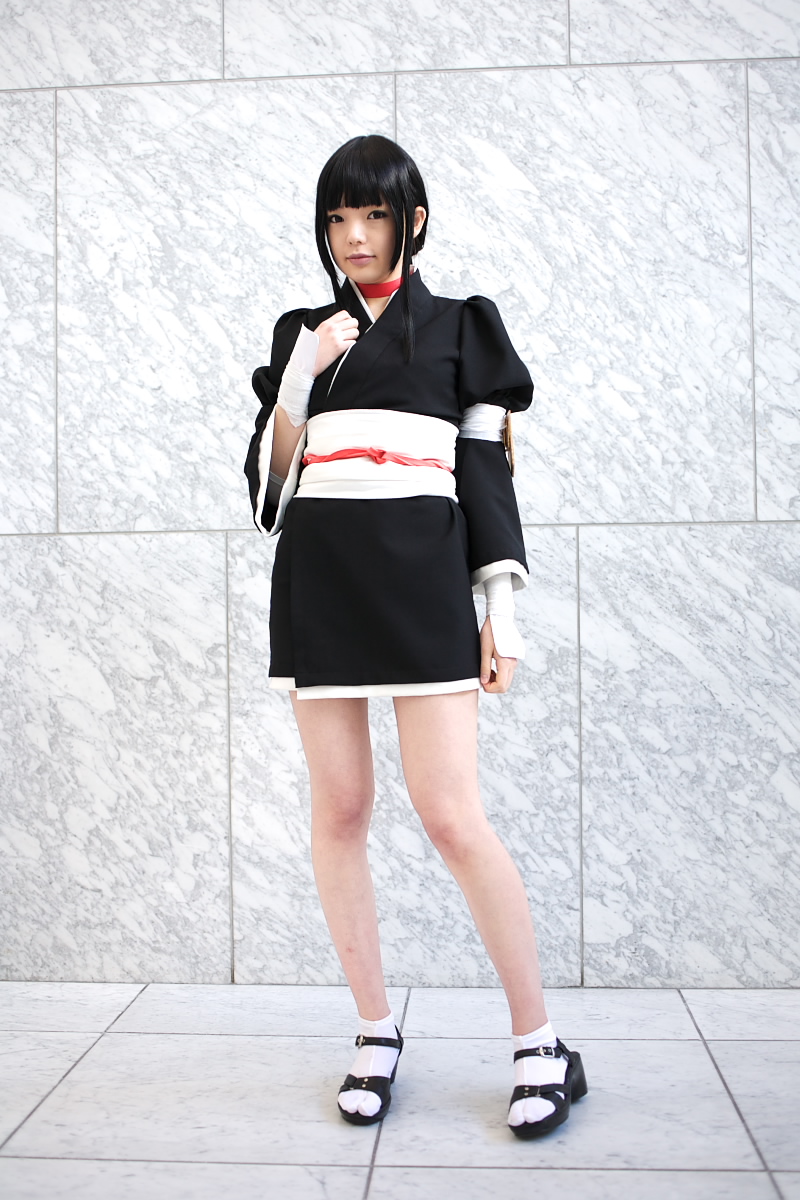 namada, kurotsuchi nemu, bleach, black footwear, white legwear, highres, photo (medium), 1girl, asian, black hair, black kimono, blunt bangs, breasts, choker, contrapposto, cosplay, female focus, full body, indoors, japanese clothes, kimono, looking at viewer, makeup, mascara, puffy sleeves, short kimono, sidelocks, small breasts, solo, standing, tabi, tile floor, tiles, wide sleeves