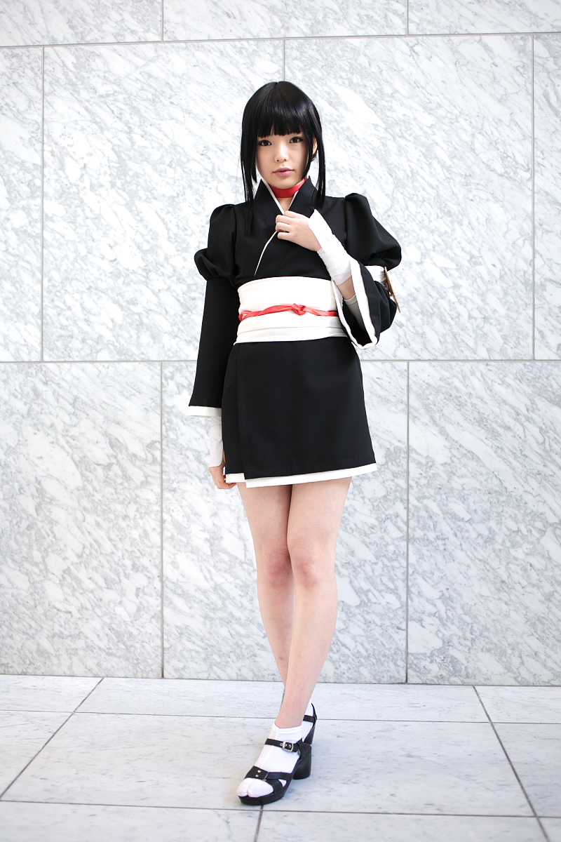 namada, kurotsuchi nemu, bleach, black footwear, white legwear, highres, photo (medium), 1girl, asian, black hair, black kimono, blunt bangs, breasts, choker, cosplay, eyeshadow, female focus, full body, indoors, japanese clothes, kimono, looking at viewer, makeup, mascara, parted lips, puffy sleeves, short kimono, sidelocks, small breasts, solo, standing, tabi, tile floor, tiles, wide sleeves