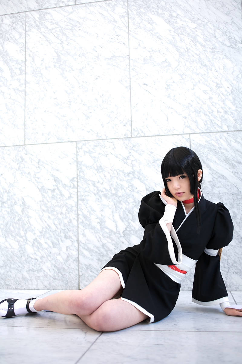 namada, kurotsuchi nemu, bleach, black footwear, white legwear, highres, photo (medium), 1girl, arm support, asian, black hair, black kimono, blunt bangs, breasts, cosplay, female focus, full body, indoors, japanese clothes, kimono, looking at viewer, makeup, mascara, on floor, parted lips, puffy sleeves, short kimono, sitting, small breasts, solo, tabi, wide sleeves, yokozuwari