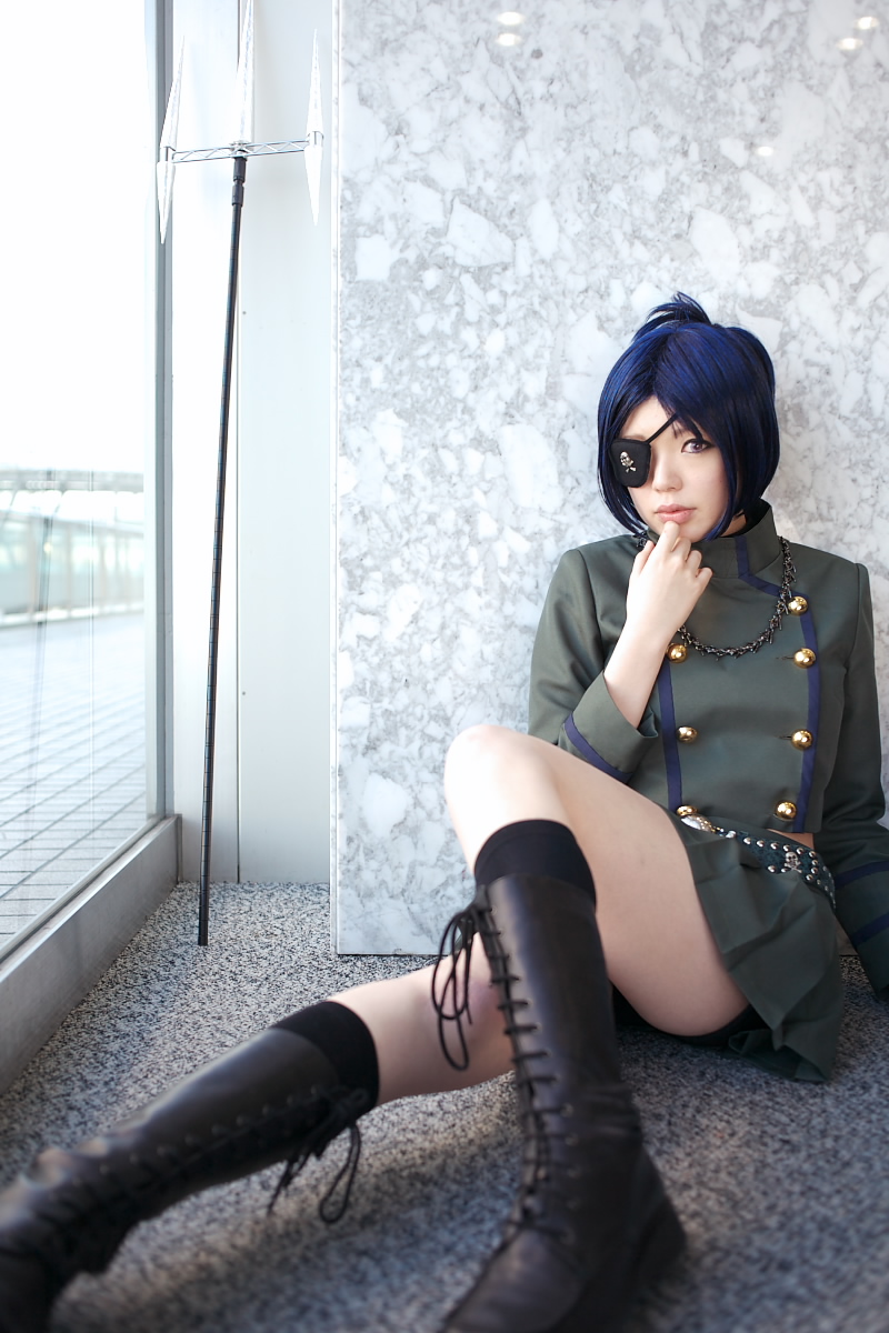 namada, chrome dokuro, kateikyoushi hitman reborn, katekyo hitman reborn!, highres, photo (medium), 1girl, asian, black socks, blue hair, blurry, boots, breasts, color contacts, cosplay, depth of field, eyepatch, female focus, indoors, lace-up boots, looking at viewer, makeup, mascara, midriff, miniskirt, on floor, parted lips, pleated skirt, polearm, rug, short hair, sitting, skirt, skull and crossbones, skull belt, small breasts, socks, solo, trident, weapon, window