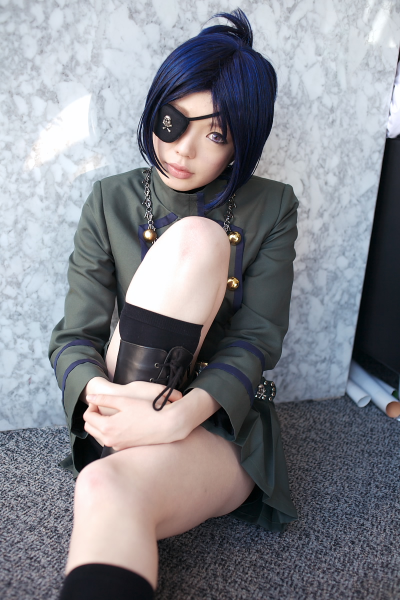 namada, chrome dokuro, kateikyoushi hitman reborn, katekyo hitman reborn!, highres, photo (medium), 1girl, asian, black socks, blue hair, boots, breasts, color contacts, cosplay, eyepatch, female focus, hugging own legs, lace-up boots, looking at viewer, makeup, mascara, miniskirt, on floor, pleated skirt, rug, short hair, sitting, skirt, skull and crossbones, small breasts, socks, solo