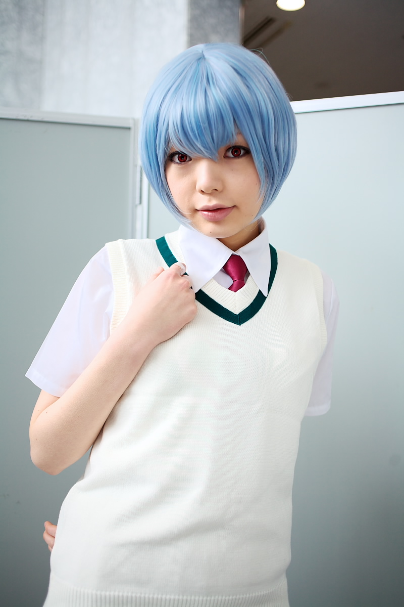 namada, ayanami rei, neon genesis evangelion, highres, photo (medium), 1girl, alternate costume, arm behind back, asian, blue hair, breasts, color contacts, cosplay, female focus, indoors, looking at viewer, necktie, parted lips, red eyes, red necktie, school uniform, shirt, short hair, short sleeves, skirt, small breasts, solo, standing, sweater vest, white shirt