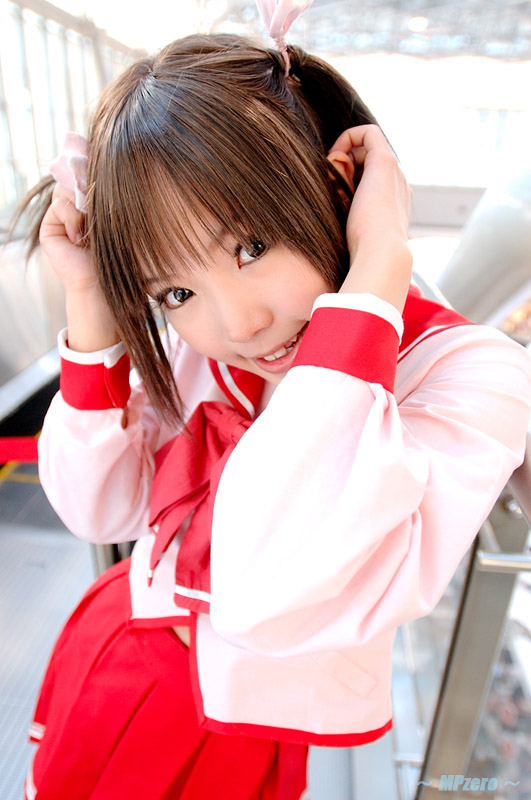 kipi-san, yuzuhara konomi, to heart (series), to heart 2, photo (medium), 1girl, asian, blunt bangs, brown eyes, brown hair, cosplay, female focus, hands up, head tilt, long sleeves, looking at viewer, mole, parted lips, pleated skirt, red skirt, school uniform, serafuku, short hair, skirt, smile, solo, teeth, twintails, yuzuhara konomi (cosplay)