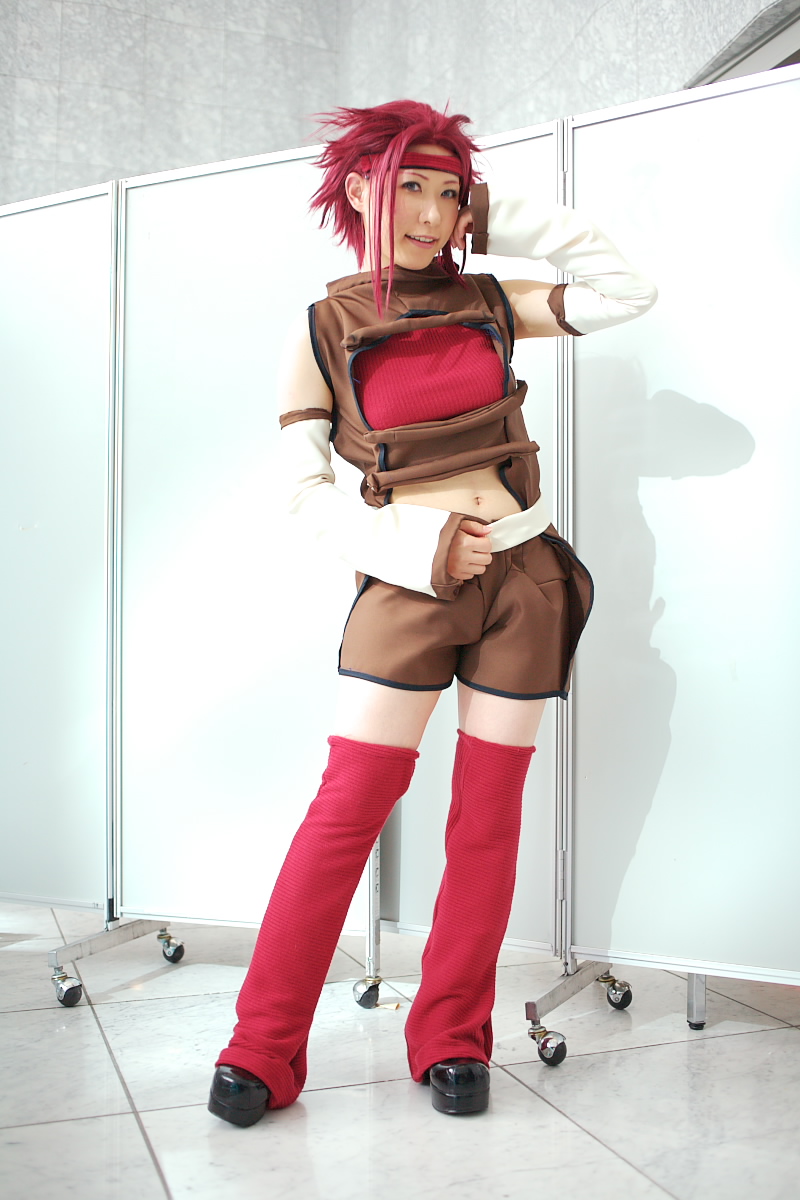 chippi, kouzuki kallen, code geass, highres, photo (medium), 1girl, asian, blue eyes, color contacts, contrapposto, cosplay, female focus, kouzuki kallen (cosplay), looking at viewer, midriff, red hair, short hair, solo