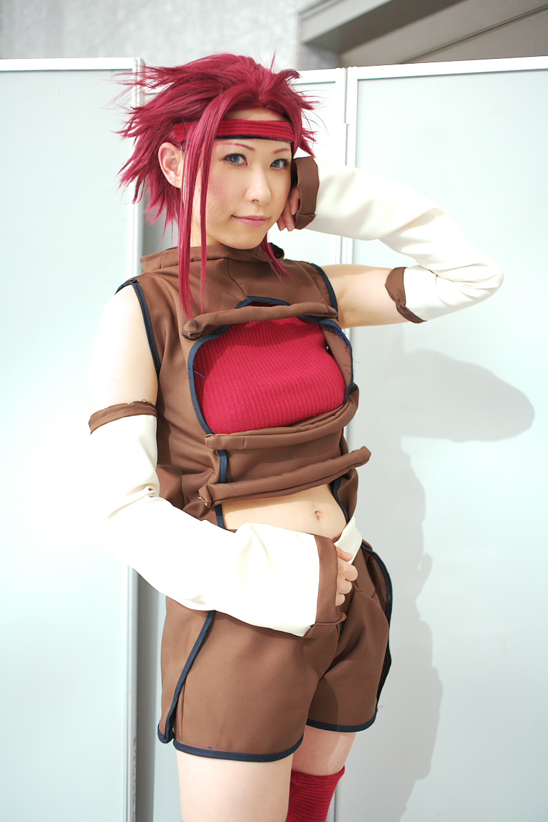 chippi, kouzuki kallen, code geass, highres, photo (medium), 1girl, asian, blue eyes, color contacts, cosplay, female focus, kouzuki kallen (cosplay), looking at viewer, midriff, red hair, short hair, solo