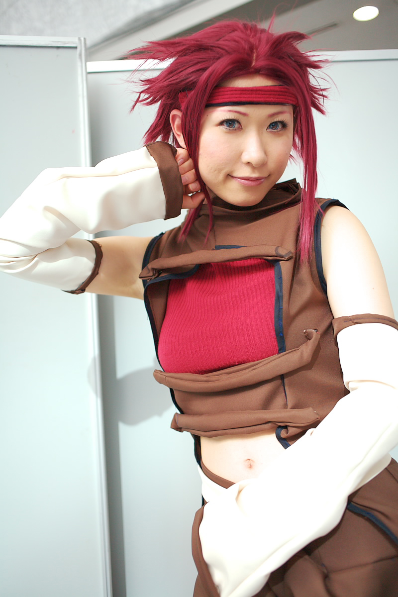 chippi, kouzuki kallen, code geass, highres, photo (medium), 1girl, asian, blue eyes, color contacts, cosplay, female focus, kouzuki kallen (cosplay), looking at viewer, midriff, red hair, short hair, solo