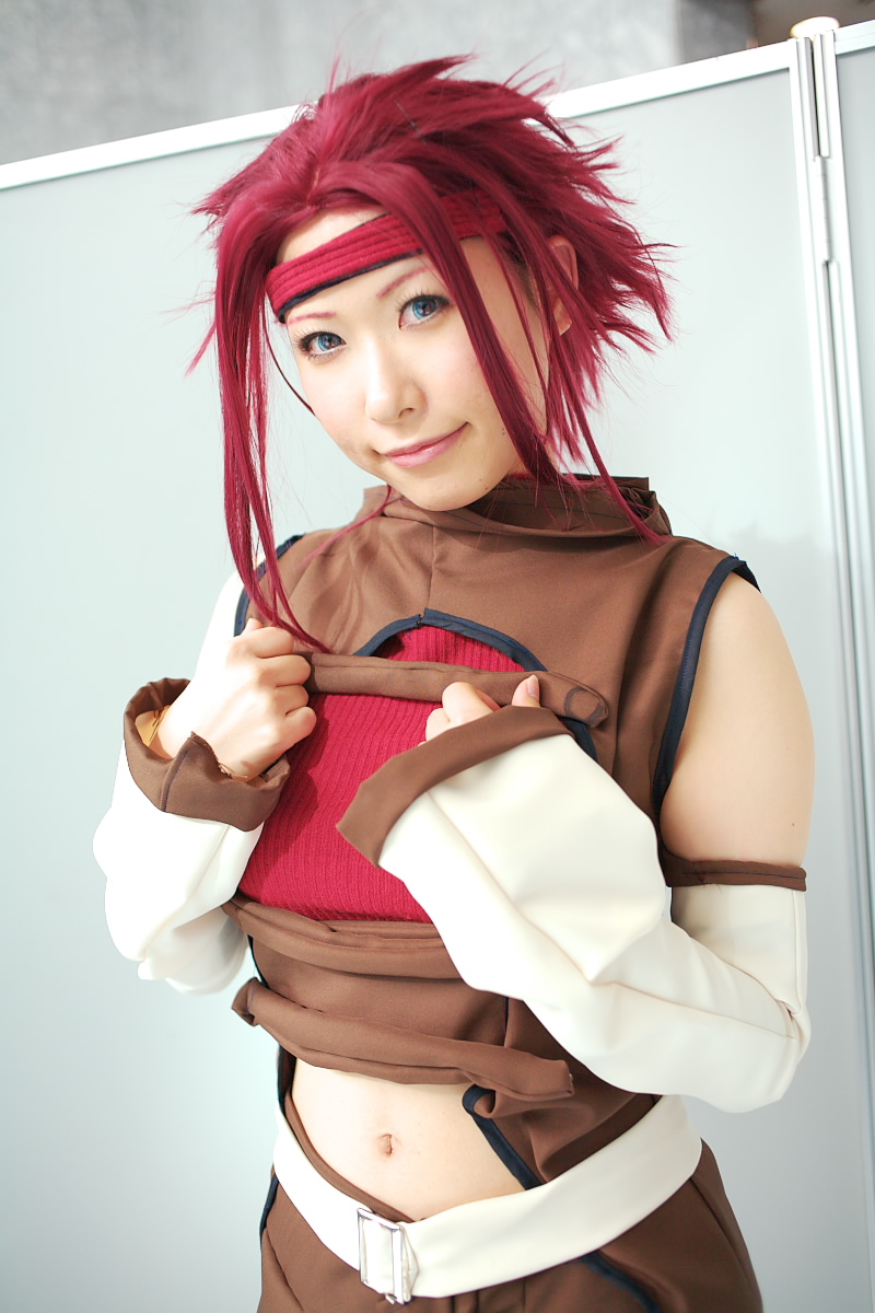 chippi, kouzuki kallen, code geass, highres, photo (medium), 1girl, asian, blue eyes, color contacts, cosplay, female focus, indoors, kouzuki kallen (cosplay), looking at viewer, midriff, red hair, short hair, solo