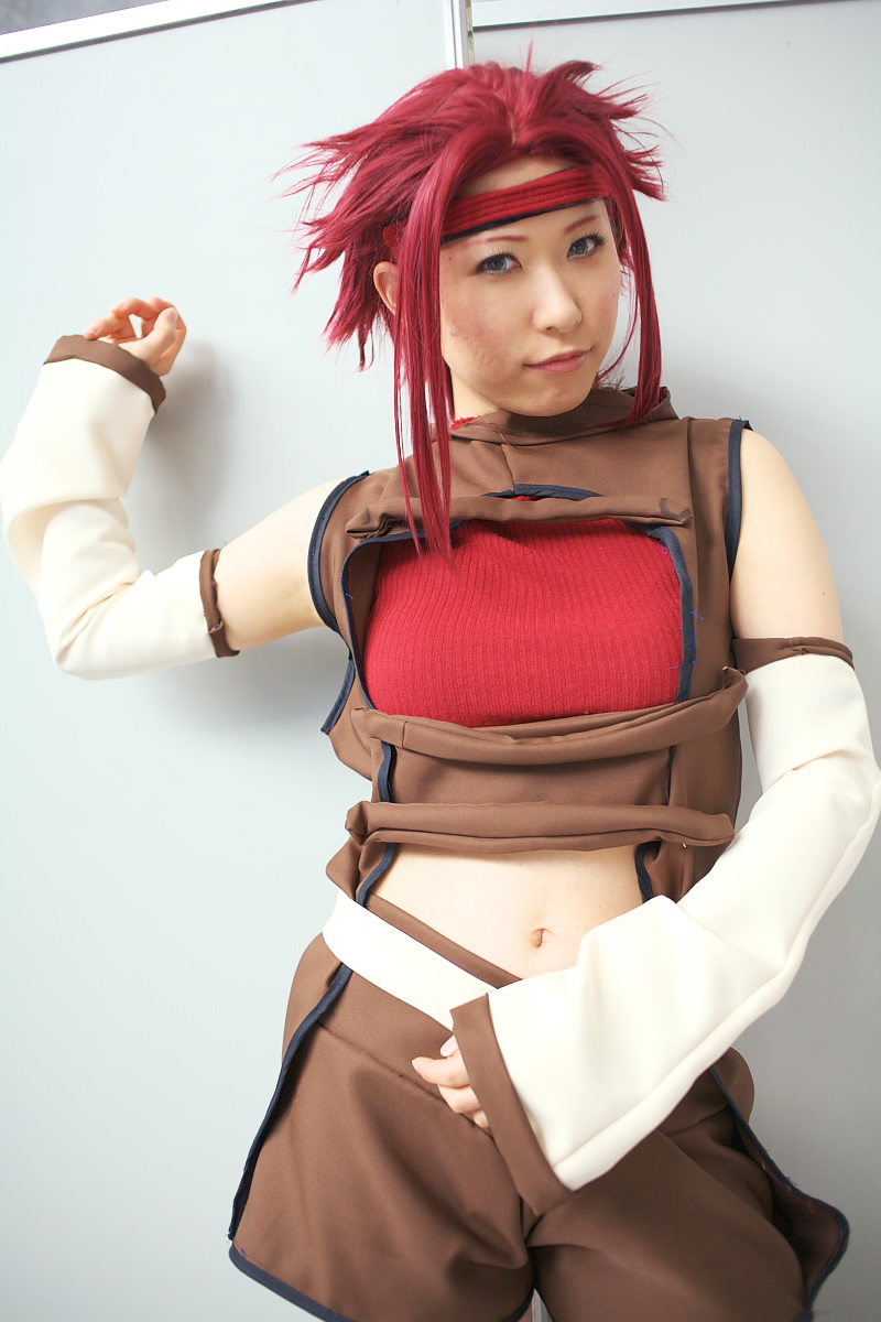 chippi, kouzuki kallen, code geass, highres, photo (medium), 1girl, asian, blue eyes, color contacts, cosplay, female focus, indoors, kouzuki kallen (cosplay), looking at viewer, midriff, red hair, short hair, solo