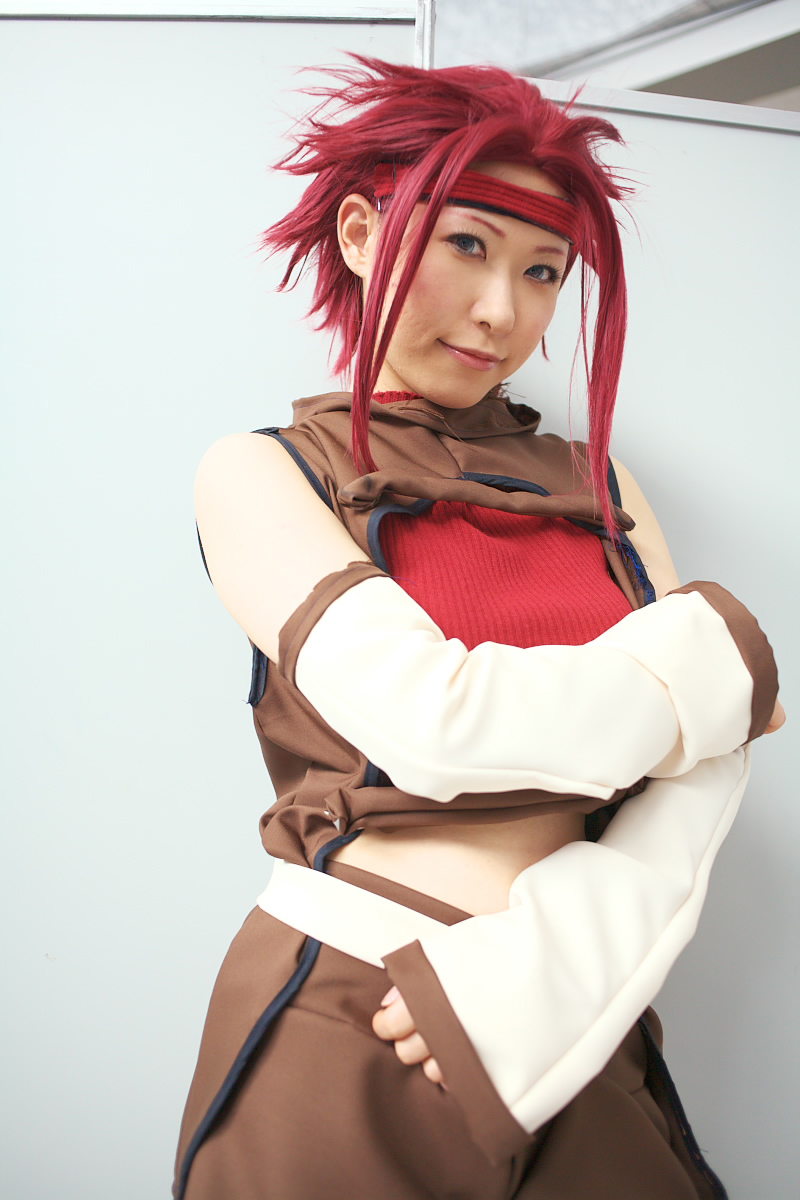 chippi, kouzuki kallen, code geass, highres, photo (medium), 1girl, asian, blue eyes, color contacts, cosplay, female focus, indoors, kouzuki kallen (cosplay), looking at viewer, midriff, red hair, short hair, solo