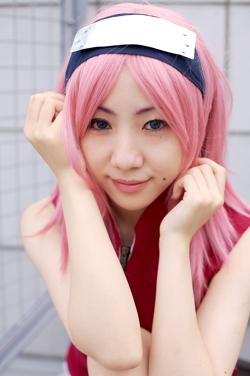 haruno sakura, naruto (classic), naruto (series), highres, photo (medium), 1girl, asian, bare shoulders, black eyes, cosplay, dress, eyelashes, female focus, haruno sakura (cosplay), lips, looking at viewer, mole, outdoors, pink hair, red dress, short hair, sleeveless, sleeveless dress, smile, solo, zipper